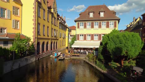 Tourists-Takes-a-Gondola-Ride-in-Water-Canal-in-La-Petite-Venise-in-Colmar