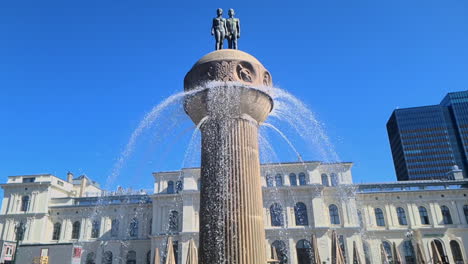 Fountain-at-Christian-Frederiks-Plass-in-Oslo,-Norway-on-Sunny-Summer-Day,-Slow-Motion