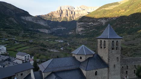 Torla-Church-in-Ordesa-Y-Monte-Perdido-National-Park,-Pyrenees,-North-Spain---Aerial-4k