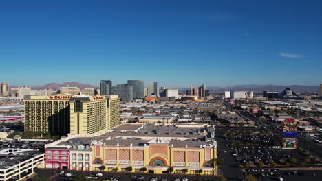 Las-Vegas-USA,-Establishing-Drone-Shot-of-The-Orleans-Hotel-Casino-With-Strip-Buildings-in-Background-and-Traffic-on-Tropicana-Avenue