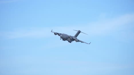 Military-Cargo-Airplane-C-17-Globemaster-Flying-with-Extended-Gear