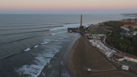 Aerial-Perspectives-of-Sunrise:-coast,-Lighthouse,-and-Nature-in-Maspalomas-beach