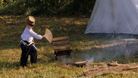 Confederate-Boy-faning-campfire