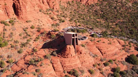 Aerial-View,-Chapel-of-Holy-Cross,-Landmark-of-Sedona-AZ,-Modern-Church-on-Red-Rocks,-Drone-Shot