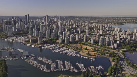 Vancouver-BC-Canada-Aerial-v86-drone-flyover-Stanley-Park-capturing-bayshore-marina,-waterfront-Coal-Harbour,-West-End-neighborhood-and-downtown-cityscape---Shot-with-Mavic-3-Pro-Cine---July-2023