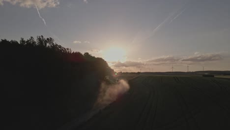 Agricultural-farming-with-a-view-of-renewable-energy-wind-turbines-during-sunset