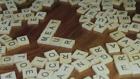 Letter-tiles-added-to-word-MEAT-to-form-crossword-of-MEAT-MURDER