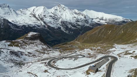 Grossglockner-High-Alpine-Road-and-Snowy-Mountain-Pass-in-Austria-Alps---Aerial-4k