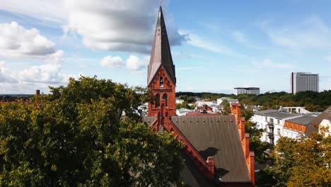 church-in-small-town,-wonderful-blue-sky,-warnemünde,-drone
