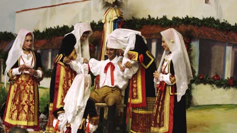 Ritual-dressing-of-Su-Composidori,-Sartiglia-feast,-Oristano,-Sardinia,-Italy,-Europe-Man-is-dressed-in-traditional-costume