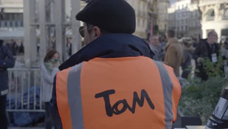 Slow-motion-shot-of-an-event-worker-with-a-high-visibility-vest-in-Montpellier