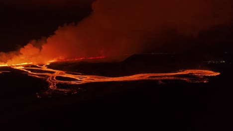 Icelandic-fissure-eruption-near-Grindavik-town-at-night-in-2024,-aerial