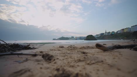 Low-camera-pan-on-Tenby-South-Beach,-Wales