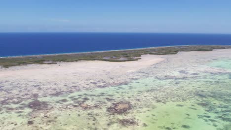 An-eastern-salt-flat-and-wetlands-with-clear-blue-sky,-midday,-aerial-view