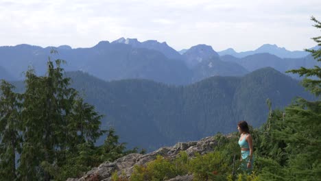 A-Woman-Over-Mountains-Near-Elfin-Lakes,-Garibaldi-Provincial-Park,-Squamish,-British-Columbia,-Canada