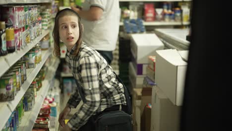 a-jewish-kid-made-a-mess-in-a-grocery-store-and-runing-away,-taken-in-isreal,-back-shot