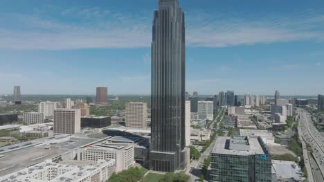 An-aerial-establishing-shot-of-The-Williams-Tower-under-blue-skies-with-wispy-clouds-in-the-Uptown-District-of-Houston,-Texas