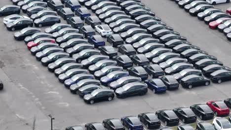 Aerial-drone-footage-showing-the-massive-amount-of-electric-EV-inventory-at-a-tesla-dealership