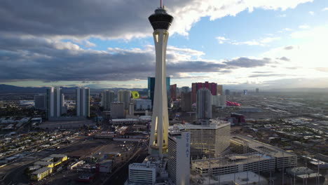 Las-Vegas-NV-USA,-The-Strat-and-North-Part-of-Strip,-Hotel-Casino-Buildings-and-Traffic-at-Sunset,-Drone-Aerial-View