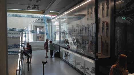 Wide-shot-of-group-of-people-in-exhibition-hall-at-Zeppelin-Museum-in-Germany