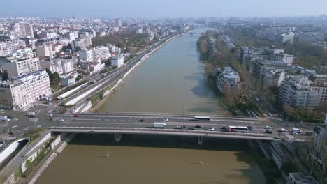 Cars-driving-on-bridge-crossing-Seine-River,-Paris-in-France