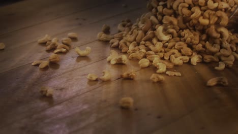 Cashew-nuts,-tapping-noises-as-they-hit-floor-surface-irregularly