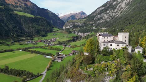 Weissenstein-Castle-on-Top-of-a-Cliff-in-Matrei-in-Osttirol,-Isel-Valley,-Tyrol,-Austria---Aerial-4k