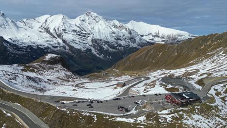 Grossglockner-High-Alpine-Road-and-Snowy-Mountain-Pass-in-Austria-Alps---Aerial-4k-Circling