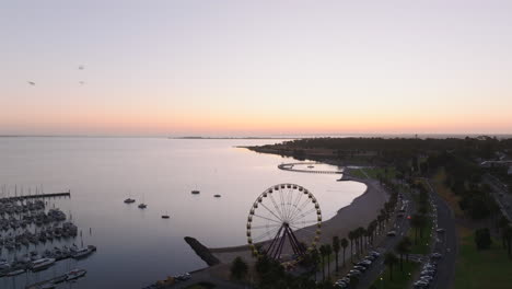 AERIAL-Eastern-Beach-Geelong,-Australia-At-Dawn-With-Ferris-Wheel