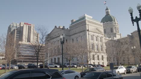 Outside-of-Indiana-state-capitol-building-in-Indianapolis,-Indiana-with-video-panning-right-to-left-at-an-angle