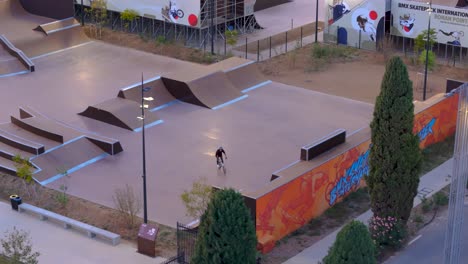 Aerial-view-of-a-man-on-BMX-bike-cycling-in-the-Montpellier-Grammont-Skatepark
