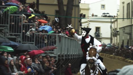 Su-Componidori-horse-riding-at-the-Sartiglia-feast-and-parade,-Oristano-carnival,-Sardinia,-Italy-Slow-motion