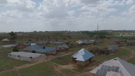 Forward-aerial-flyover-of-village-in-the-middle-belt-of-Nigeria-on-sunny-day