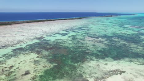 Aerial-view-coral-reef-Caribbean-Sea,-pan-right-show-stunning-natural-landscape,-Los-Roques