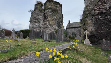 Ancient-Cemetery-on-a-spring-morning-with-castle-and-old-headstones