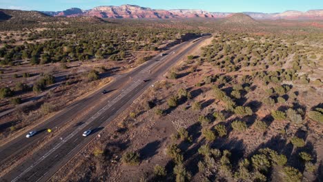 Aerial-View-of-Traffic-on-Arizona-89a-State-Route,-Cars-on-Freeway-and-Desert-Landscape