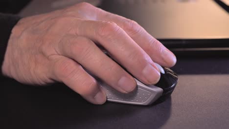 Senior-man's-hand-using-a-computer-mouse