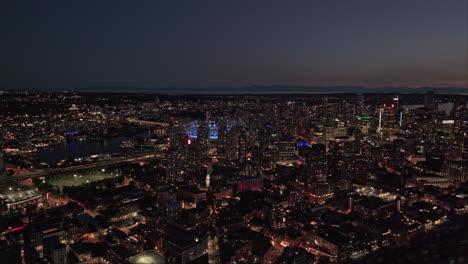 Vancouver-BC-Canada-Aerial-v70-flyover-Eastside-capturing-illuminated-Gastown-and-waterfront-downtown-cityscape,-industrial-shipyard-and-harbour-views-at-dusk---Shot-with-Mavic-3-Pro-Cine---July-2023