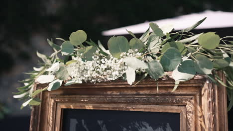 Vintage-frame-adorned-with-eucalyptus-and-baby's-breath