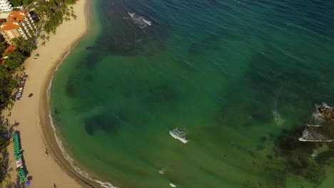 Pedestal-drone-shot-of-Miami-Beach,-showing-the-whole-stretch-of-the-shoreline,-hotels-and-condominiums-by-the-bay,-located-in-Itea-in-Central-Greece