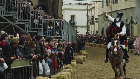 Su-Componidori-horse-riding-at-the-Sartiglia-feast-and-parade,-Oristano-carnival,-Sardinia,-Italy-Slow-motion