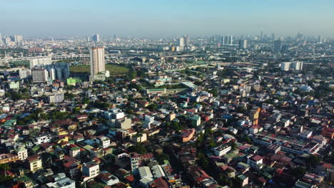 Colorful-dwellings-and-streets-of-Makati,-Metro-Manila,-Philippines---Aerial-view