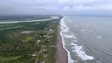 Drone-shot-of-mexican-coast-line-with-houses-at-veracruz
