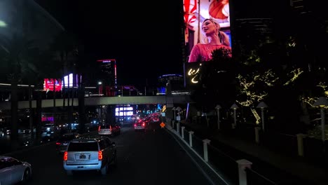 Night-Drive-on-Las-Vegas-Strip,-Traffic-Jam-and-Shiny-Buildings,-Hotels-and-Casinos,-Point-of-View