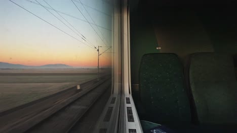 Train-window-view-on-sunrise-Croatia,-Slovenia