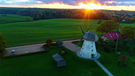 Aerial-View-Of-Araisi-Windmill-During-Sunrise-in-Drabesi,-Latvia