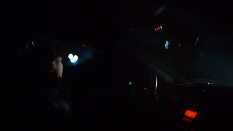 guy-in-the-car-at-night-waiting-with-lights