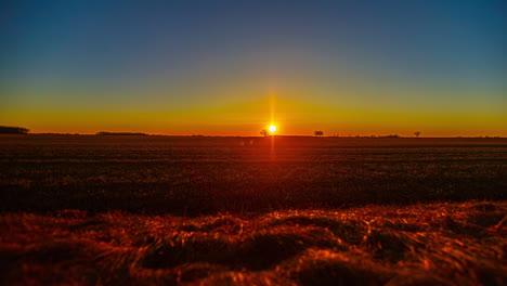 Sunrise-time-lapse-over-agriculture-field-rural-landscape-clear-sky-nature