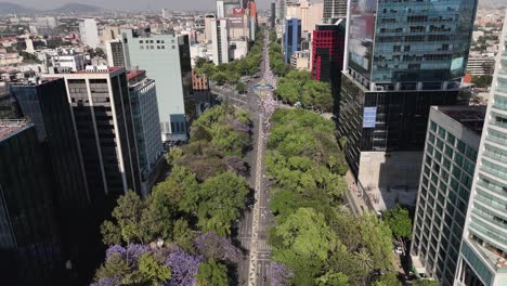 Aerial-Footage-of-Women's-Day-March-Crossing-Avenida-Reforma,-Mexico-City