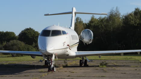 Close-up-handheld-shot-of-landed-Bombardier-Challenger-with-protected-turbine